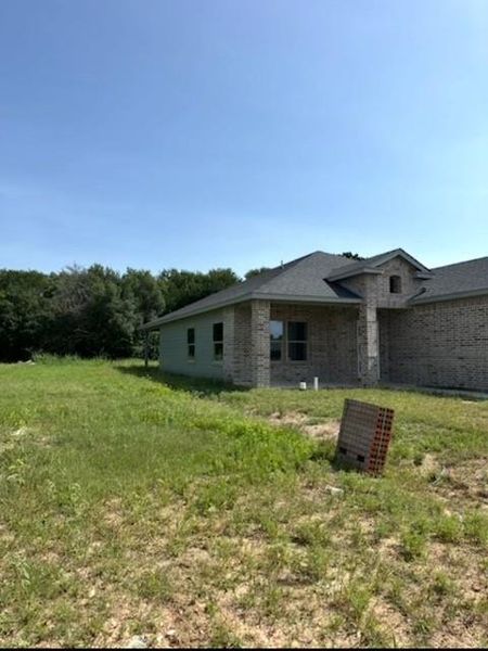 View of side of property featuring brick siding View of side of property featuring brick siding
