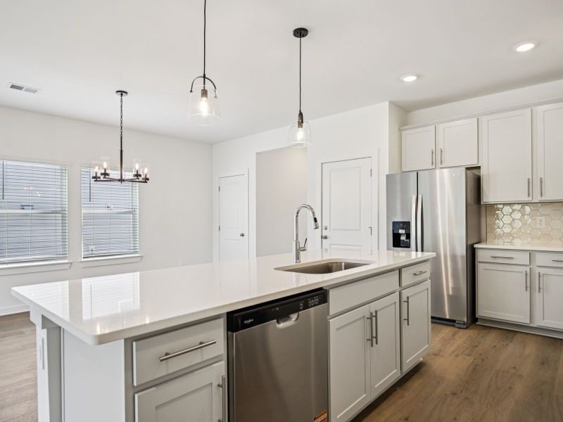 Prep dinner in the kitchen without missing the conversation in the great room.