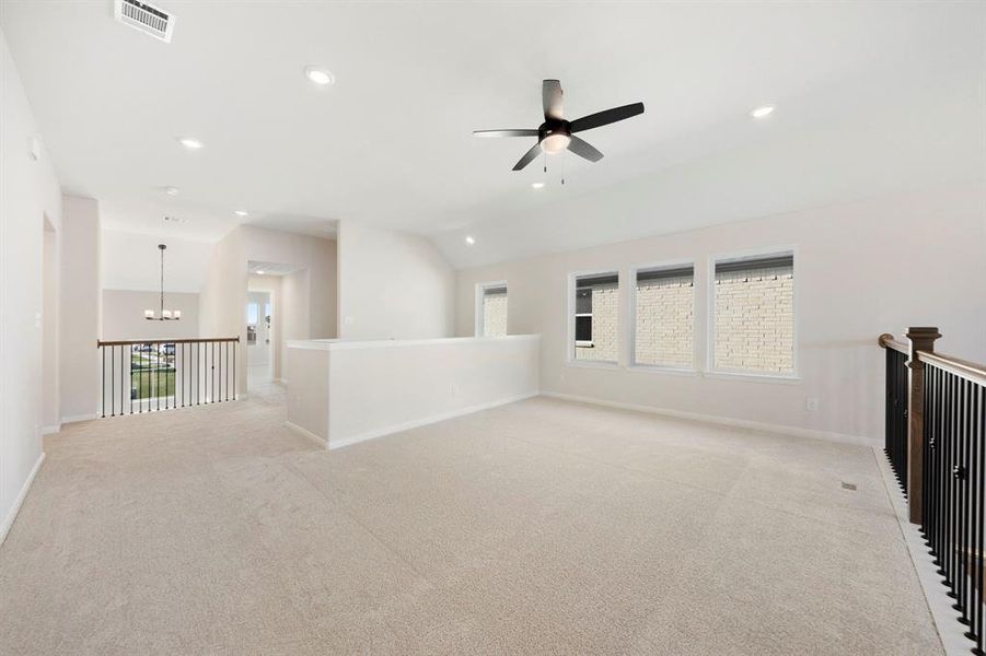 Light, bright and airy, the family fun time never ends in this over the top game room!