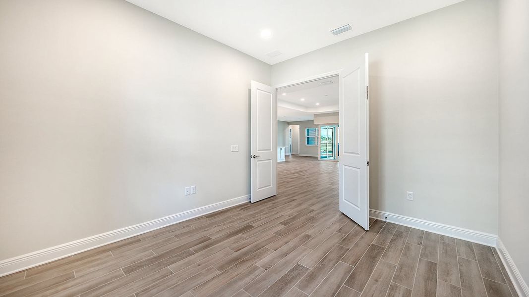 Spacious, unfurnished interior of a new home in Canoe Creek Real Estate and Homes for Sale in Parrish, FL - Neal Communities, Parrish (Image 46).