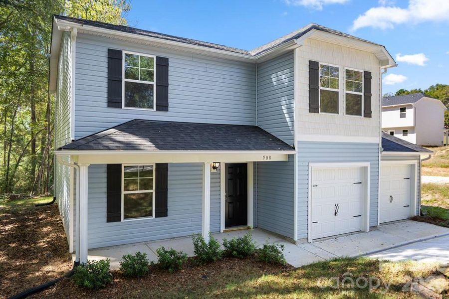 Front exterior of a new home in , Lancaster, SC, highlighting curb appeal (Image 18).