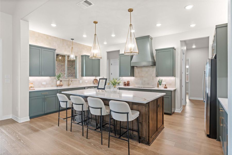Culinary aspirations meet elegant design in this inviting kitchen, featuring a spacious island with ample seating. Culinary aspirations meet elegant design in this inviting kitchen, featuring a spacious island with ample seating.