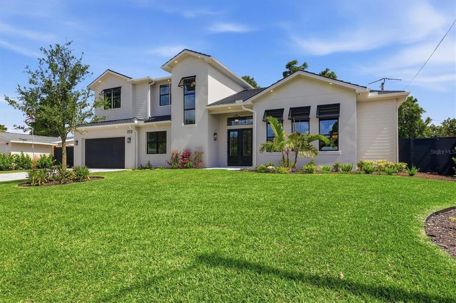 Front exterior of a new home in , Sarasota, FL, highlighting curb appeal (Image 26).