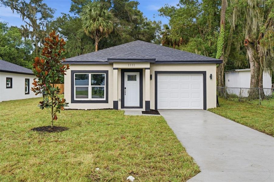 Front exterior of a new home in , Deland, FL, highlighting curb appeal (Image 18).