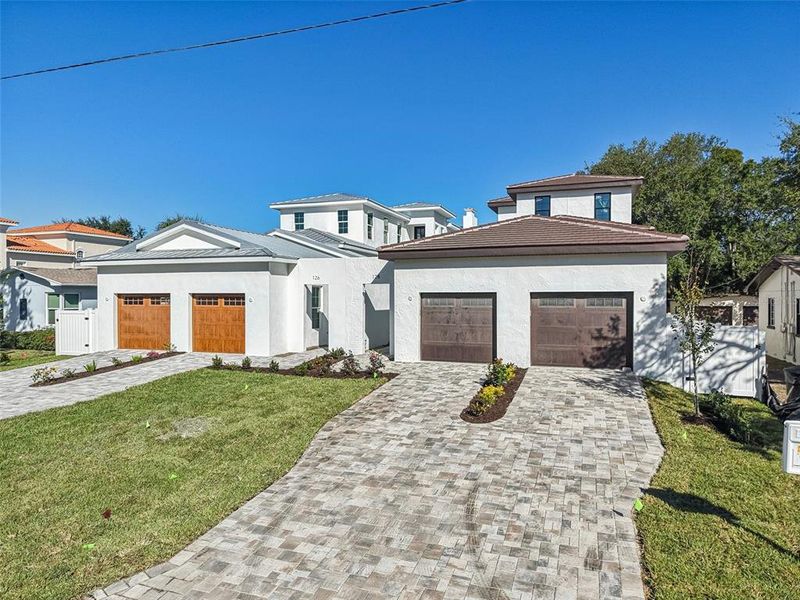Front exterior of a new home in , St. Petersburg, FL, highlighting curb appeal (Image 31). Front exterior of a new home in , St. Petersburg, FL, highlighting curb appeal (Image 31).