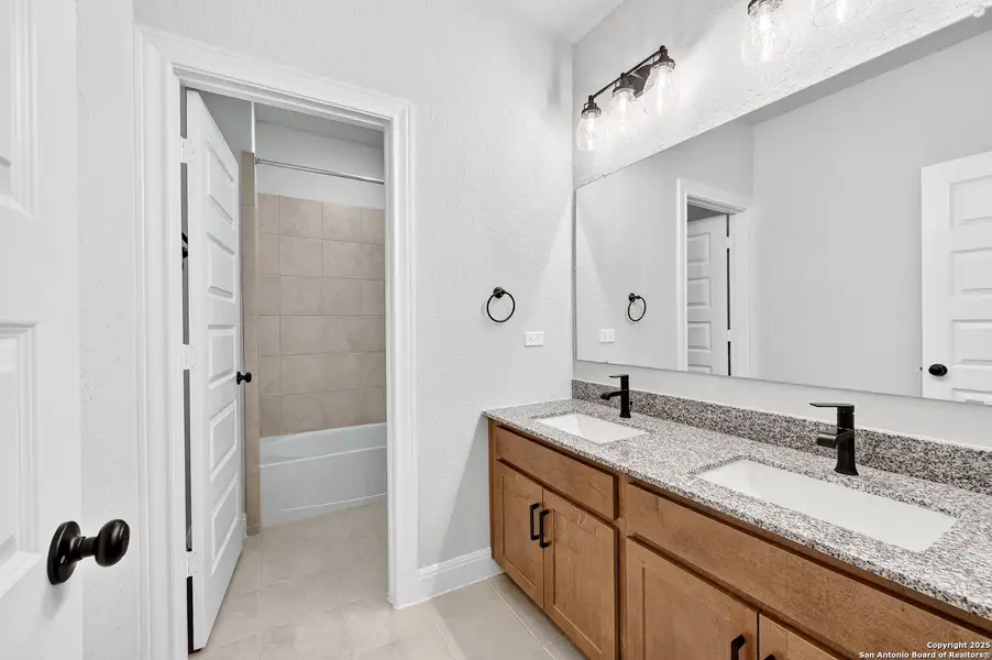 Furnished interior view inside a new home in Davis Ranch 60', San Antonio (Image 10).