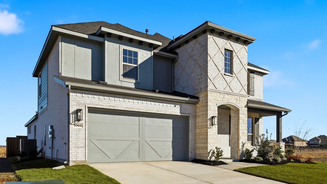 Front exterior of a new home in Green Meadows Premier, Celina, TX, highlighting curb appeal (Image 2). Front exterior of a new home in Green Meadows Premier, Celina, TX, highlighting curb appeal (Image 2).