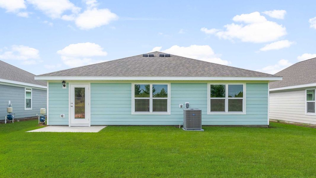 Representative exterior photo of a completed home built from the Freeport by D.R. Horton in Magnolia at the Bluffs Phase 3, Freeport, FL (Image 17).