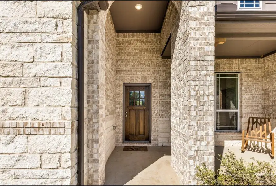Exterior details and patio area of a home in Deer Pines, Conroe (Image 3).