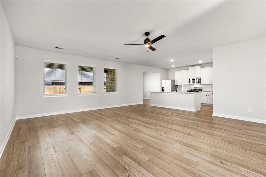 Welcome home! This open floor plan design is perfect for entertaining!  The spacious living room is flooded with natural light.