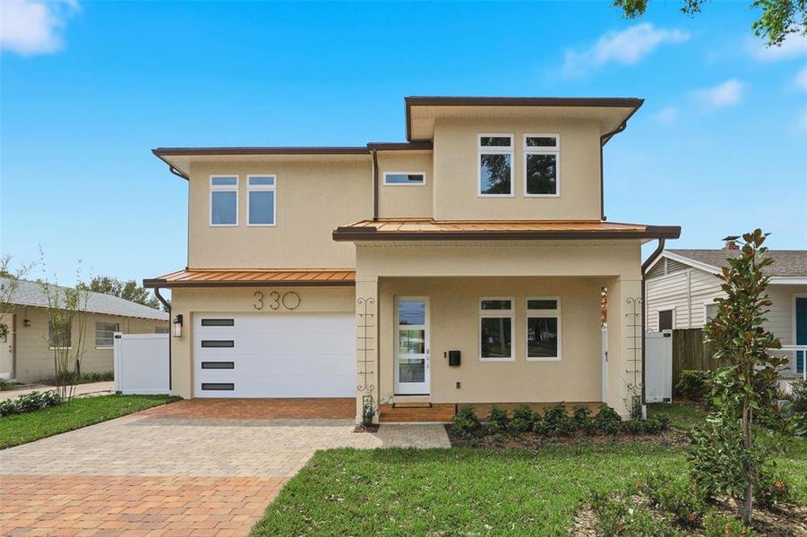 Front exterior of a new home in , Orlando, FL, highlighting curb appeal (Image 1). Front exterior of a new home in , Orlando, FL, highlighting curb appeal (Image 1).