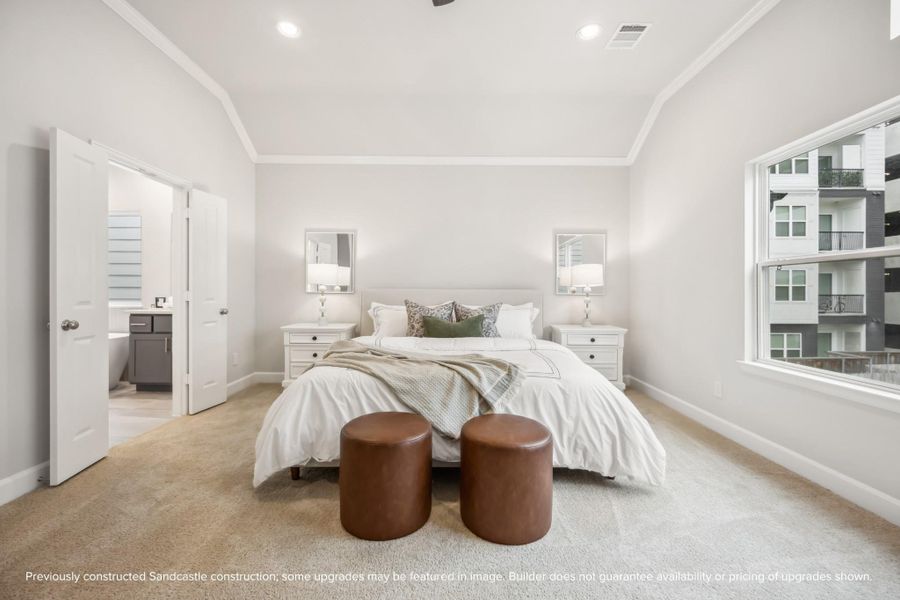 Your serene haven awaits. A vaulted ceiling and access to two closets and an en suite bathroom enhance the luxury of this spacious retreat.