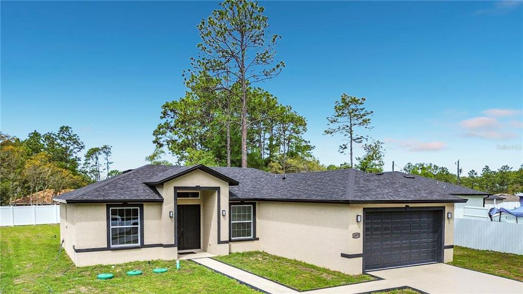 Front exterior of a new home in , Citrus Springs, FL, highlighting curb appeal (Image 20).
