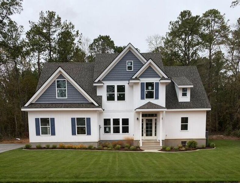 Front exterior of a new home in , Walterboro, SC, highlighting curb appeal (Image 1).