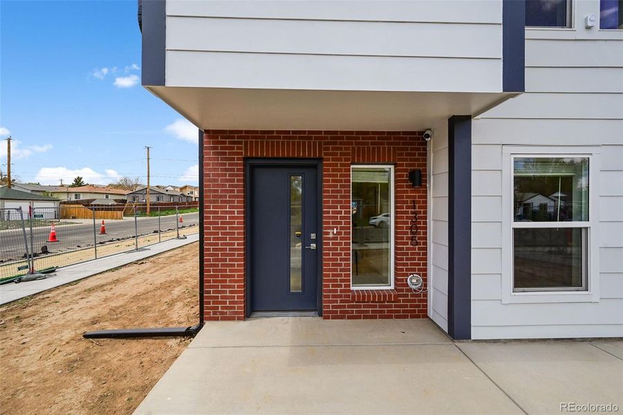 Front exterior of a new home in , Aurora, CO, highlighting curb appeal (Image 24).
