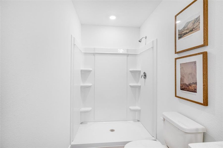 Bathroom with a shower and toilet