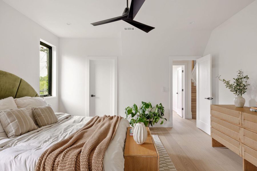 Bedroom with wood finished floors and ceiling fan Bedroom with wood finished floors and ceiling fan