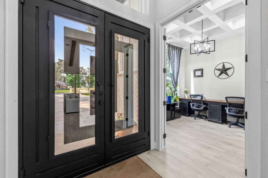 ENTRY - Custom double iron doors to the entryway.