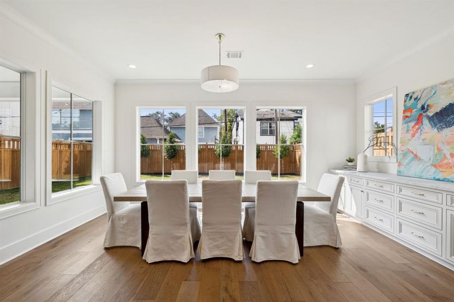 Such a special oversized dining area with built-in beverage center including marble countertops.