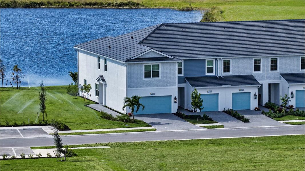 Front exterior of a new home in SkySail, Naples, FL, highlighting curb appeal (Image 1). Front exterior of a new home in SkySail, Naples, FL, highlighting curb appeal (Image 1).