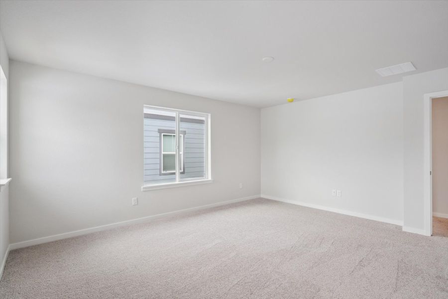 A room with a window and a carpet. A room with a window and a carpet.