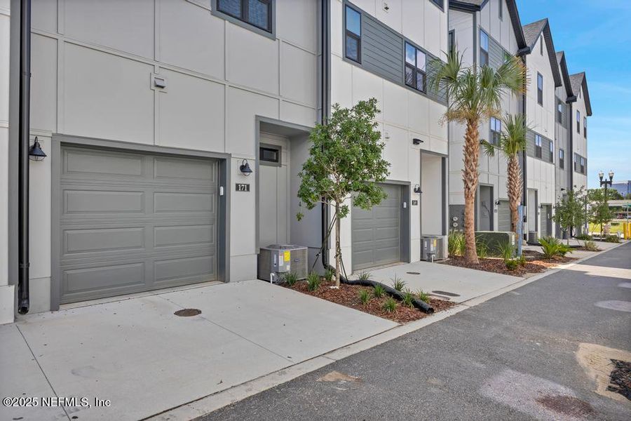 Front exterior of a new home in Johnson Commons, Jacksonville, FL, highlighting curb appeal (Image 19). Front exterior of a new home in Johnson Commons, Jacksonville, FL, highlighting curb appeal (Image 19).