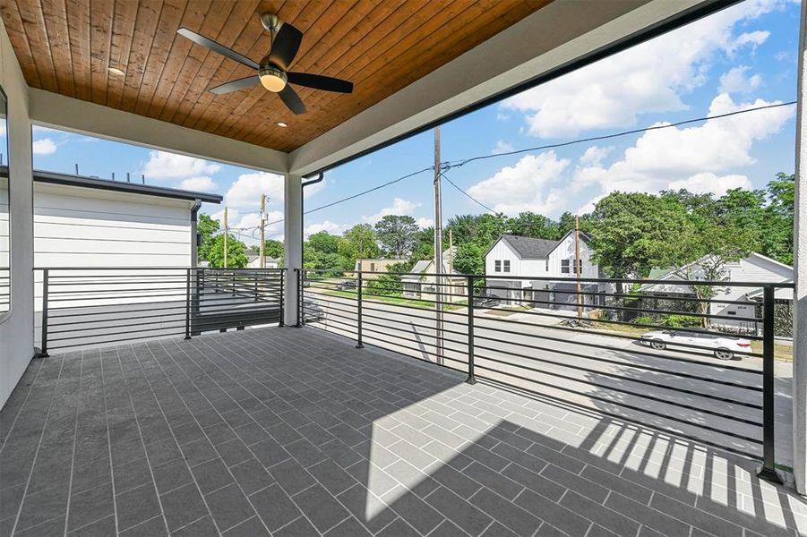 Unfurnished sunroom with wood ceiling and ceiling fan