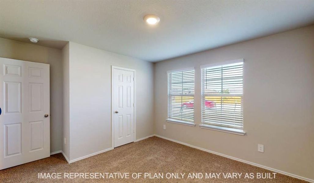 Carpeted room with neutral wall tones and white trim Carpeted room with neutral wall tones and white trim