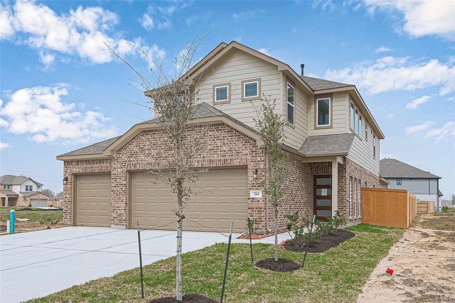 Front exterior of a new home in River Ranch, Dayton, TX, highlighting curb appeal (Image 2). Front exterior of a new home in River Ranch, Dayton, TX, highlighting curb appeal (Image 2).