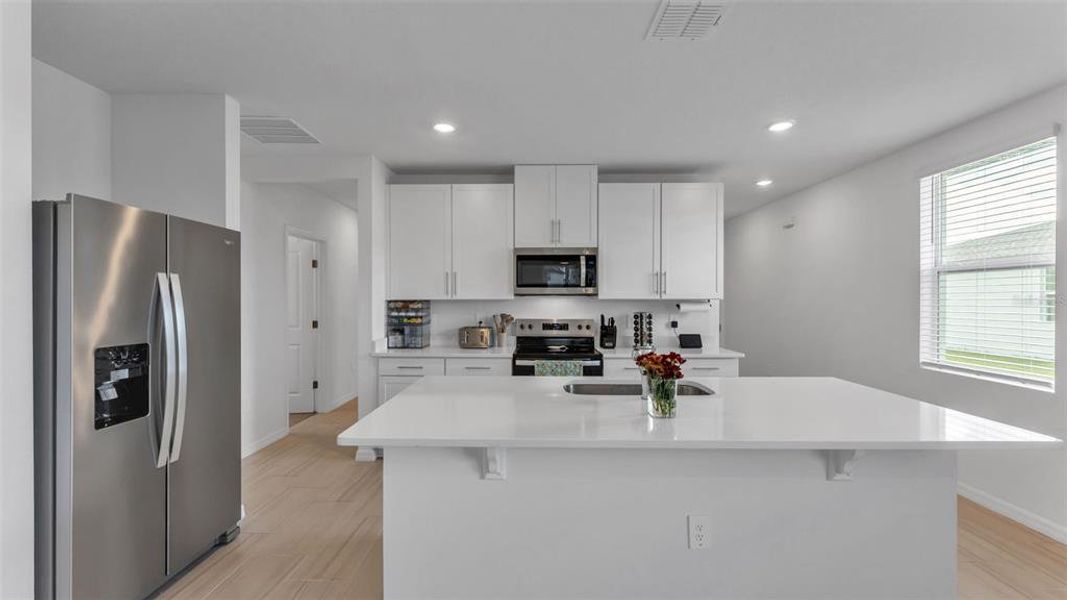 Furnished interior view inside a new home in The Grove at Stuart Crossing - Premier Series, Bartow (Image 12).