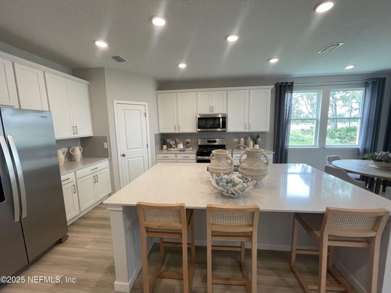 Furnished interior view inside a new home in The Magnolia Series at Reserve East, Flagler Beach (Image 9). Furnished interior view inside a new home in The Magnolia Series at Reserve East, Flagler Beach (Image 9).
