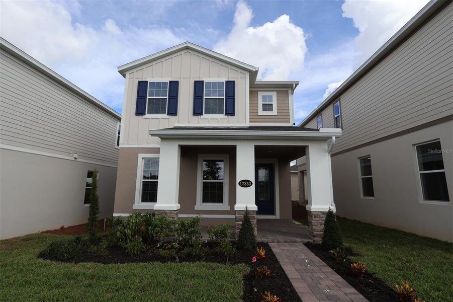 Exterior details and patio area of a home in Lake Star at Ovation, Winter Garden (Image 3).