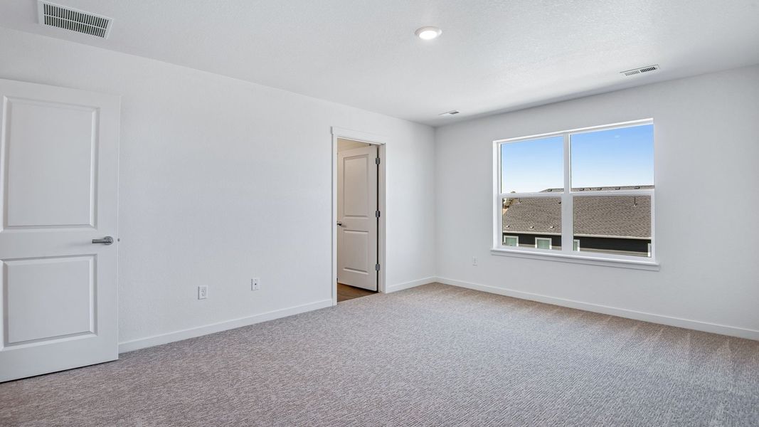Spacious, unfurnished interior of a new home in Trails at Crowfoot, Parker (Image 36).