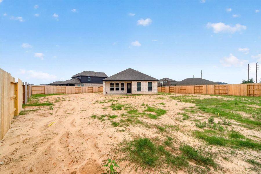 Exterior details and patio area of a home in Sunterra, Katy (Image 29).