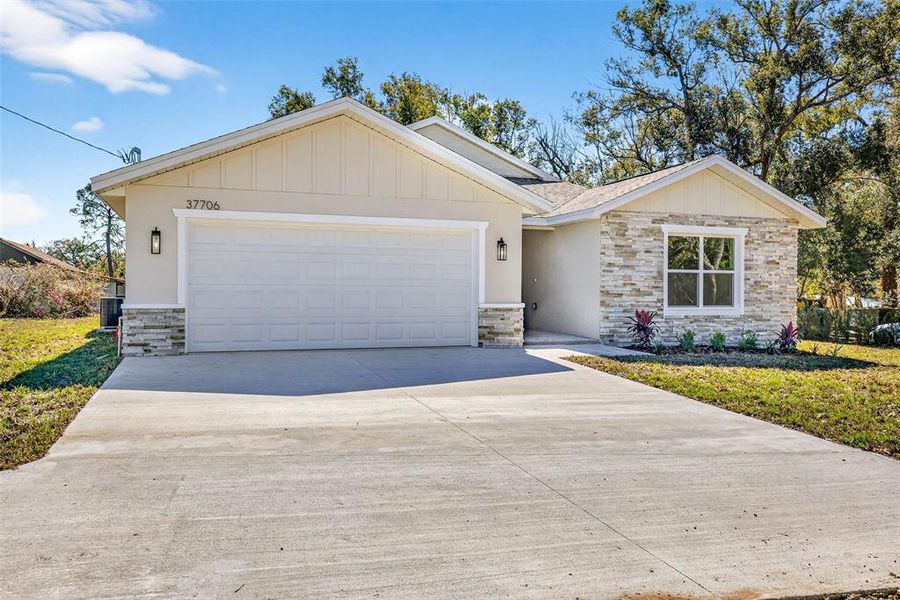 Front exterior of a new home in , Dade City, FL, highlighting curb appeal (Image 26).