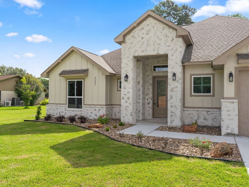 Front exterior of a new home in , Bay City, TX, highlighting curb appeal (Image 17).