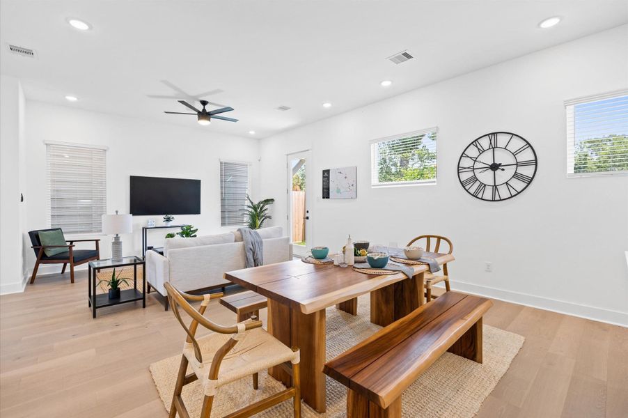 The open layout connects effortlessly to the kitchen, where a stylish island doubles as a dining space. High ceilings and strategically placed lighting enhance the airy feel, making the space ideal for both relaxation and entertaining. The open layout connects effortlessly to the kitchen, where a stylish island doubles as a dining space. High ceilings and strategically placed lighting enhance the airy feel, making the space ideal for both relaxation and entertaining.