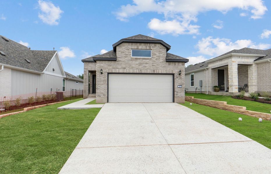 Front exterior of a new home in Sun City Texas, Georgetown, TX, highlighting curb appeal (Image 18).