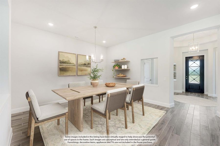 Dining room with light wood table, six chairs, pendant chandelier, and view of front entry door