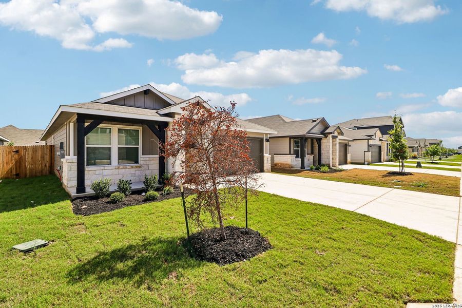 Front exterior of a new home in Estancia Ranch - Premier Series, San Antonio, TX, highlighting curb appeal (Image 25). Front exterior of a new home in Estancia Ranch - Premier Series, San Antonio, TX, highlighting curb appeal (Image 25).