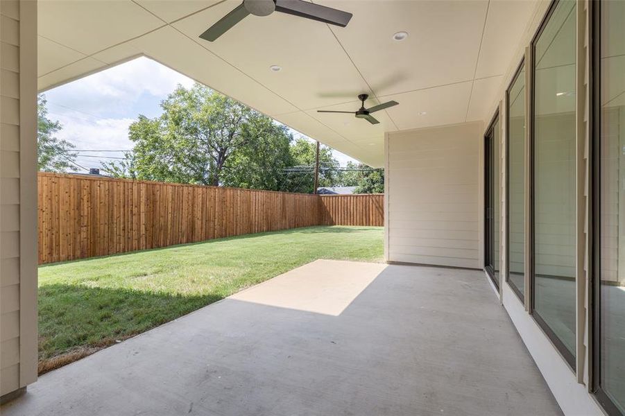 Covered living area in backyard has access to the 1/2 bath.