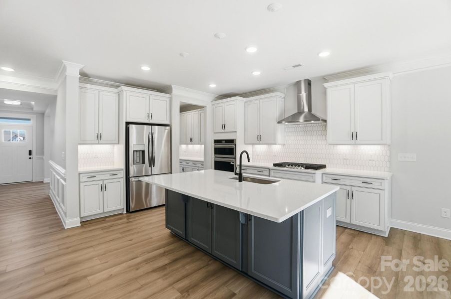 Kitchen with refrigerator included