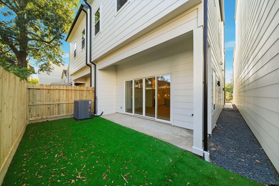 Another view of the large backyard. (Photos are of a previously completed home with upgraded artificial turf. Finishes are subject to change.)