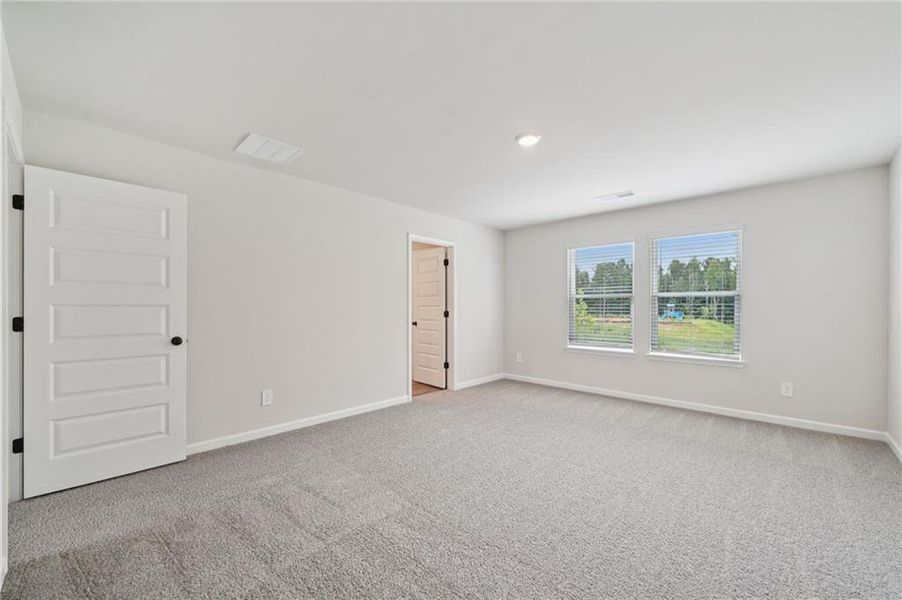 Spacious, unfurnished interior of a new home in Vines at Mill Creek - Estate Series, Braselton (Image 26).