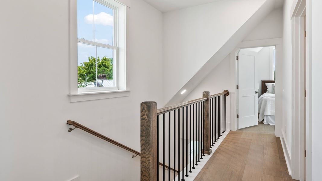 Third-floor hallway in the Sullivan home plan featuring hardwood flooring and access to secondary bedrooms.