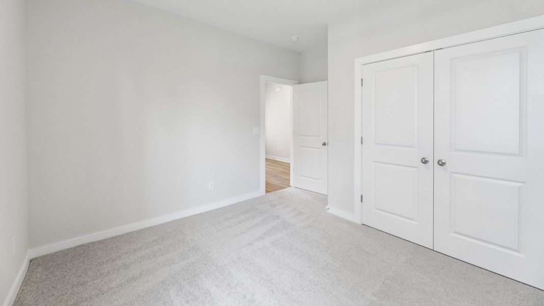Secondary Bedroom with carpet and closet Secondary Bedroom with carpet and closet
