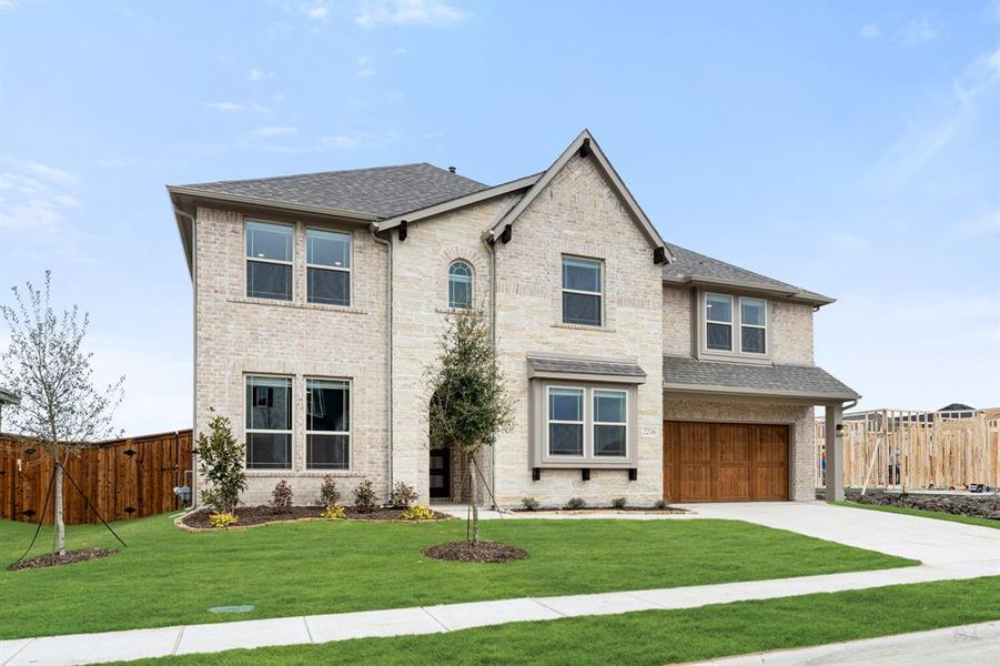 Front exterior of a new home in Sonoma Verde, McLendon-Chisholm, TX, highlighting curb appeal (Image 2).