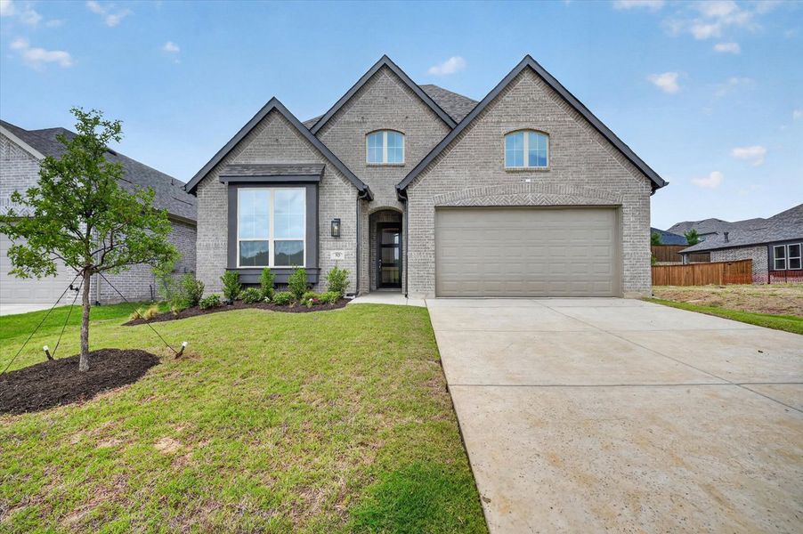 Front exterior of a new home in Gateway Village - The Reserve, Denison, TX, highlighting curb appeal (Image 1). Front exterior of a new home in Gateway Village - The Reserve, Denison, TX, highlighting curb appeal (Image 1).