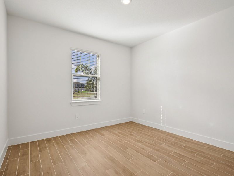 Spacious, unfurnished interior of a new home in Magnolia Bay - Reserve Series, Nokomis (Image 12).