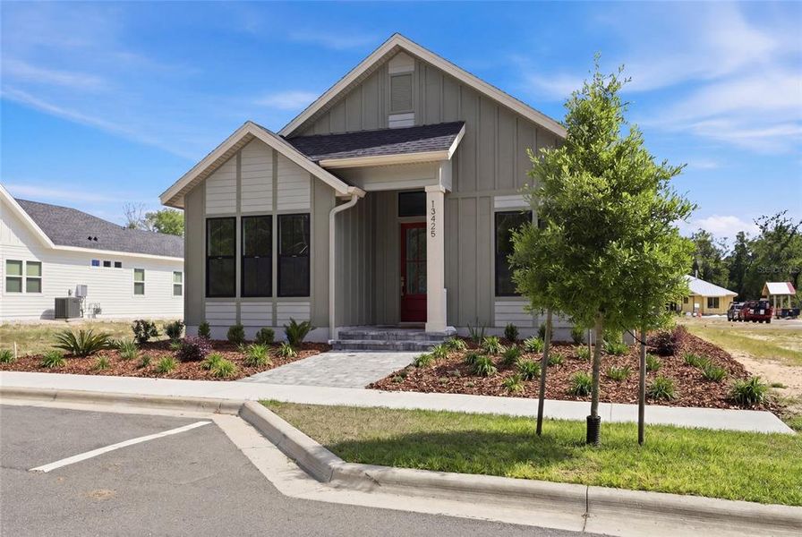 Front exterior of a new home in , Newberry, FL, highlighting curb appeal (Image 29).